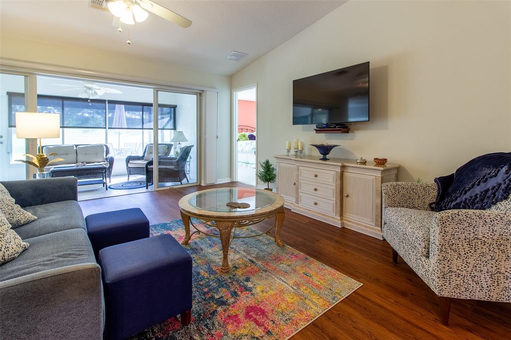 15691 Southwest 11th Court Road Ocala, FL 34473 - Photo 4 of 37 a living room with furniture and a flat screen tv