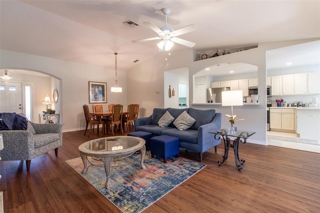 15691 Southwest 11th Court Road Ocala, FL 34473 - Photo 6 of 37 a living room with lots of furniture and kitchen view