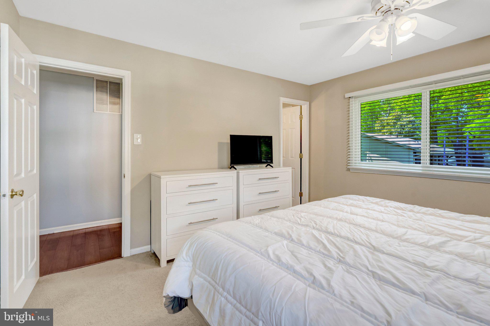 7212 Galgate Drive Springfield, VA 22153 - Photo 13 of 39 a bedroom with a bed and a flat screen tv