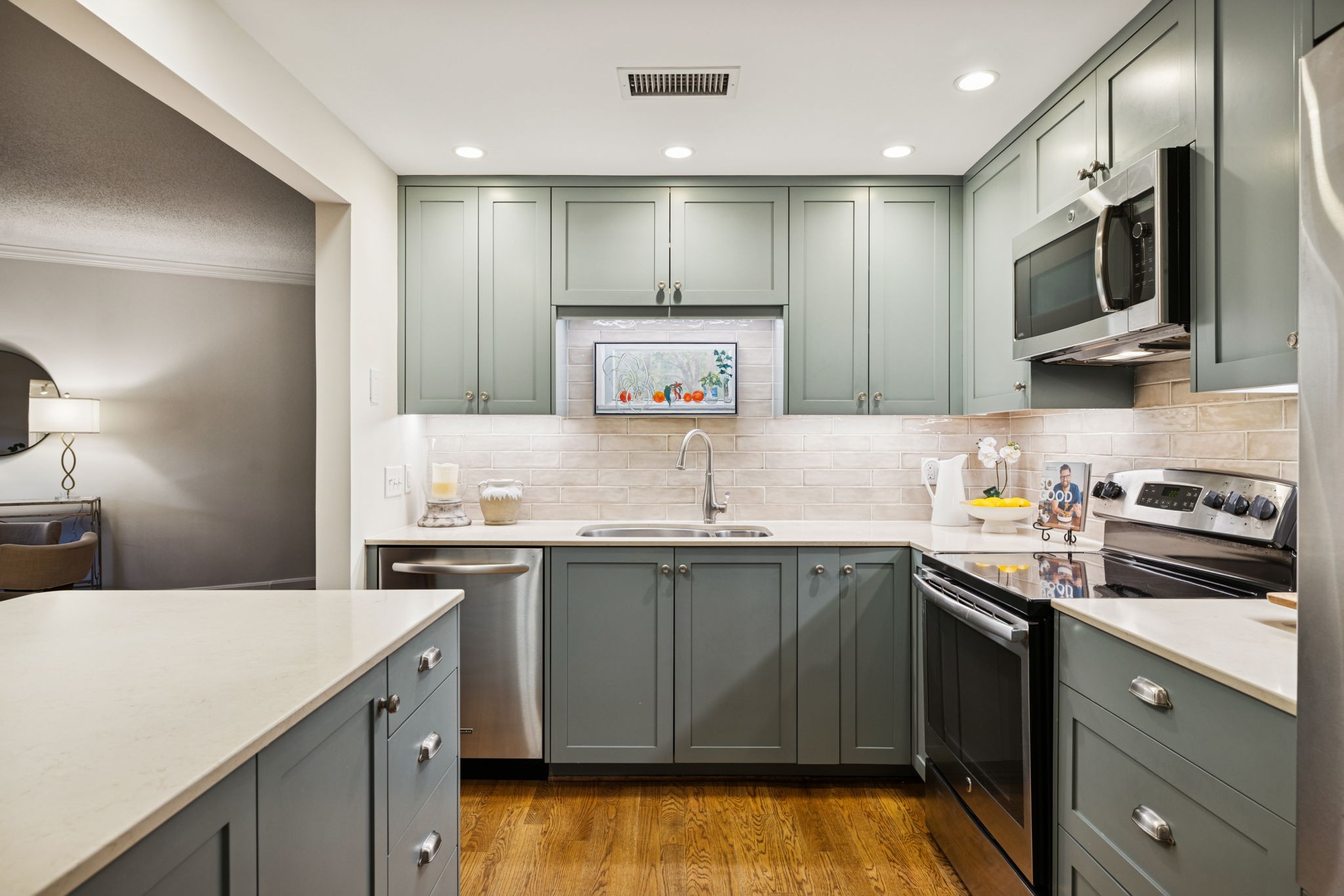 4215 Harding Pike, Unit 204 Nashville, TN 37205 - Photo 19 of 40 a kitchen with stainless steel appliances granite countertop a sink and stove top oven