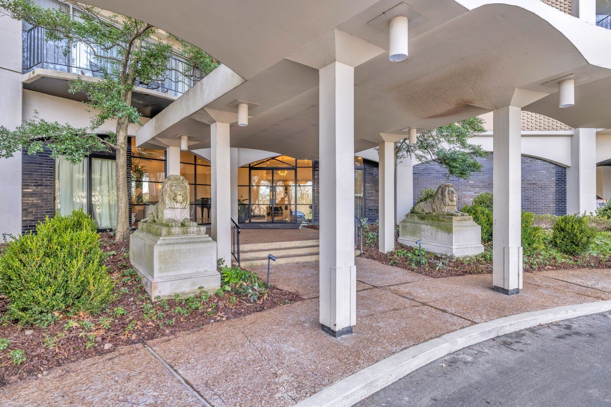 4215 Harding Pike, Unit 204 Nashville, TN 37205 - Photo 2 of 40 a front view of a house with garden