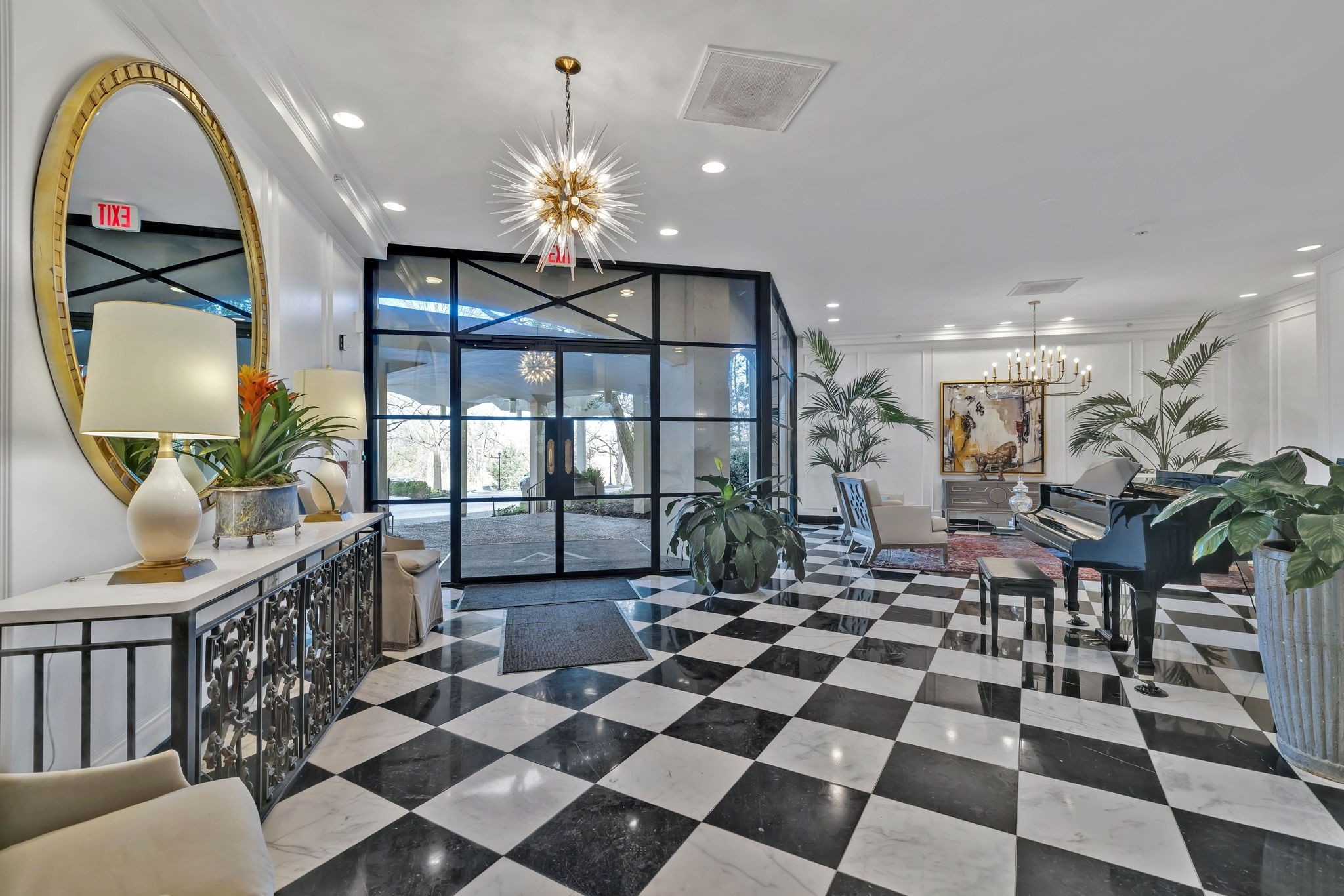 4215 Harding Pike, Unit 204 Nashville, TN 37205 - Photo 4 of 40 a living room with a black white checkered floor with couches chair and a coffee table