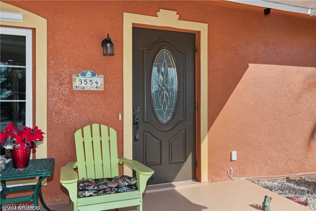 3554 Ruby Avenue St. James City, FL 33956 - Photo 11 of 43 a living room with furniture and a fireplace