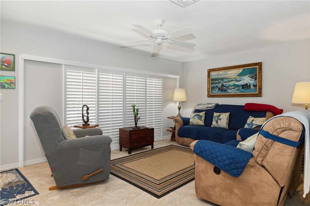 3554 Ruby Avenue St. James City, FL 33956 - Photo 13 of 43 a living room with furniture and a window