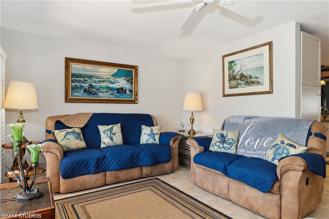 3554 Ruby Avenue St. James City, FL 33956 - Photo 14 of 43 a living room with furniture and a painting