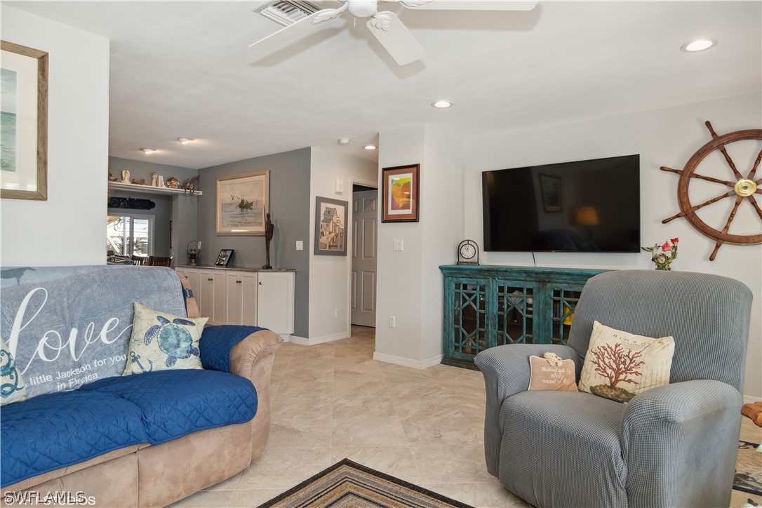 3554 Ruby Avenue St. James City, FL 33956 - Photo 15 of 43 a living room with furniture and a flat screen tv