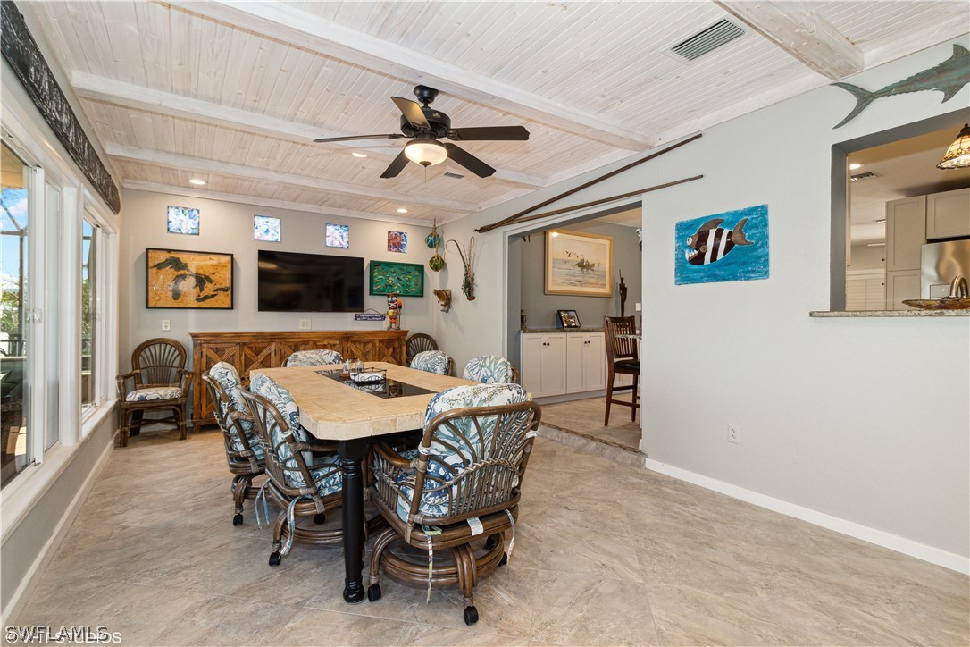 3554 Ruby Avenue St. James City, FL 33956 - Photo 23 of 43 a view of a livingroom with furniture and a flat screen tv