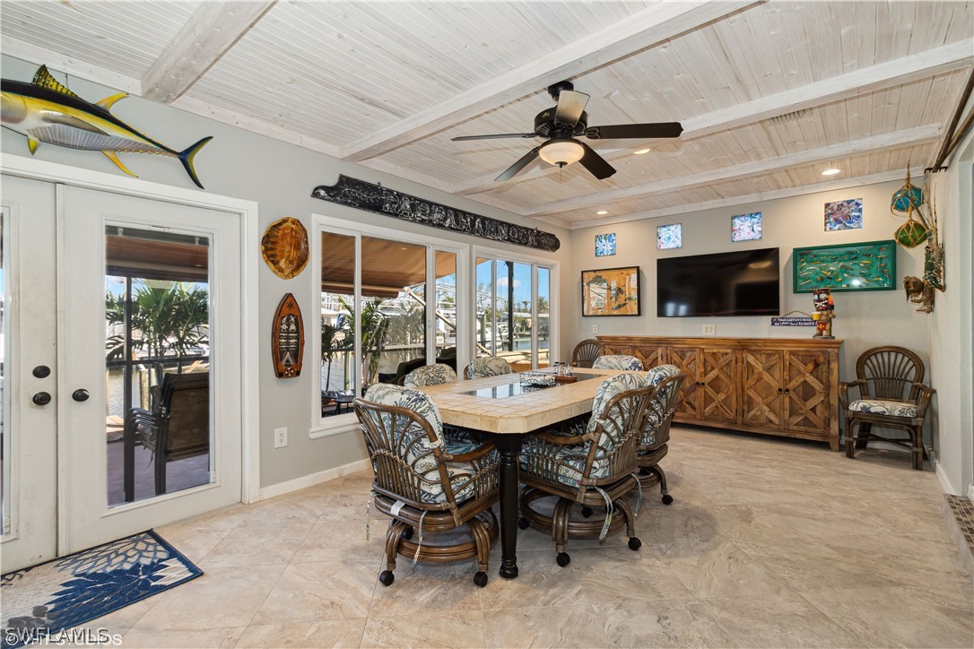 3554 Ruby Avenue St. James City, FL 33956 - Photo 24 of 43 a view of a livingroom with furniture and a flat screen tv