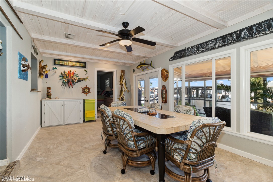 3554 Ruby Avenue St. James City, FL 33956 - Photo 25 of 43 a dining room with furniture and window