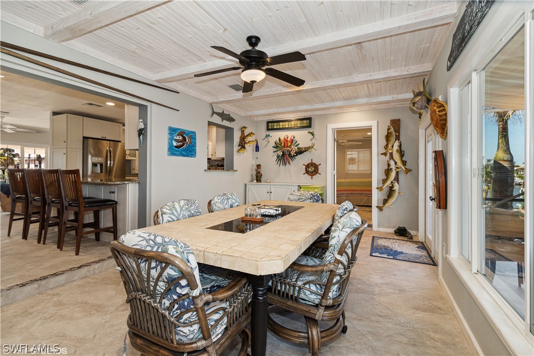 3554 Ruby Avenue St. James City, FL 33956 - Photo 26 of 43 a view of a very nice looking dining room with a table and chairs