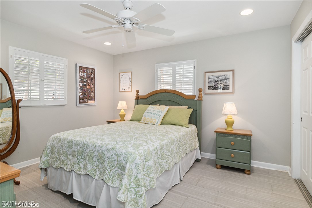 3554 Ruby Avenue St. James City, FL 33956 - Photo 32 of 43 a bedroom with a bed and a window