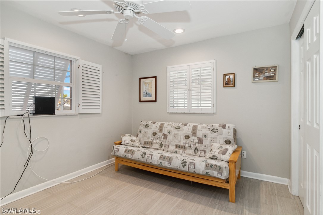 3554 Ruby Avenue St. James City, FL 33956 - Photo 34 of 43 a bedroom with a bed and a window