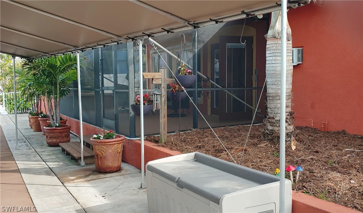 3554 Ruby Avenue St. James City, FL 33956 - Photo 37 of 43 a view of a patio with a table and chairs