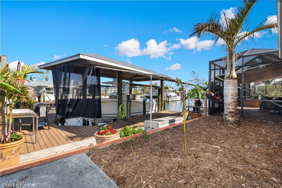 3554 Ruby Avenue St. James City, FL 33956 - Photo 38 of 43 a front view of a house with a porch