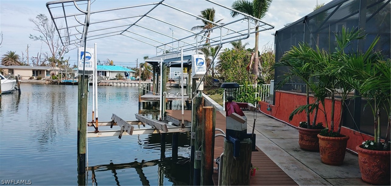 3554 Ruby Avenue St. James City, FL 33956 - Photo 5 of 43 a view of a lake from a balcony