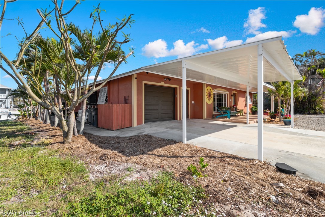 3554 Ruby Avenue St. James City, FL 33956 - Photo 9 of 43 a view of a backyard of the house
