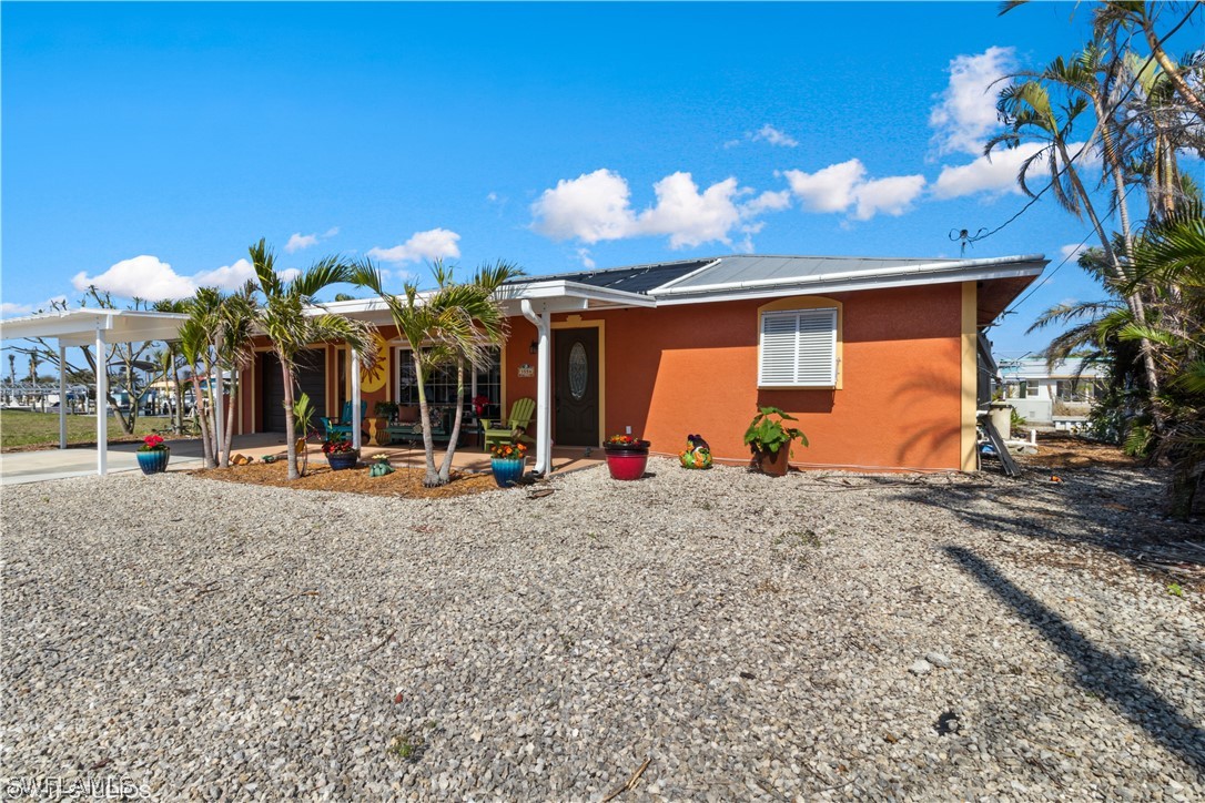 3554 Ruby Avenue St. James City, FL 33956 - Photo 10 of 43 a view of a house with basketball court