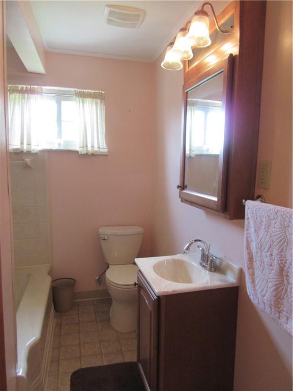 511 Coal Valley Road Jefferson Hills, PA 15025 - Photo 16 of 25 Main floor full bath has been updated. Only 6 years old. New tub surround, toilet, vanity and mirror.