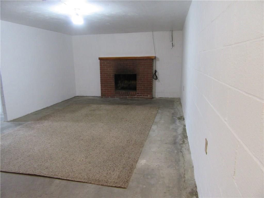 511 Coal Valley Road Jefferson Hills, PA 15025 - Photo 19 of 25 Sectioned off gameroom space from the laundry area. Wood burning fireplace.