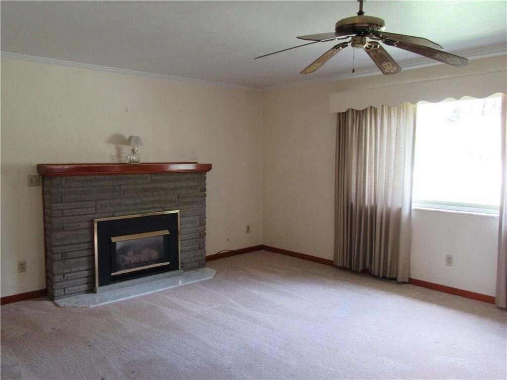 511 Coal Valley Road Jefferson Hills, PA 15025 - Photo 3 of 25 Gas fireplace in formal living room. Generous amount of natural light pours into the large front window.