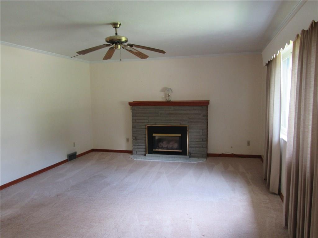 511 Coal Valley Road Jefferson Hills, PA 15025 - Photo 4 of 25 Spacious living room 20x14. Hardwood flooring can be found under the carpet.