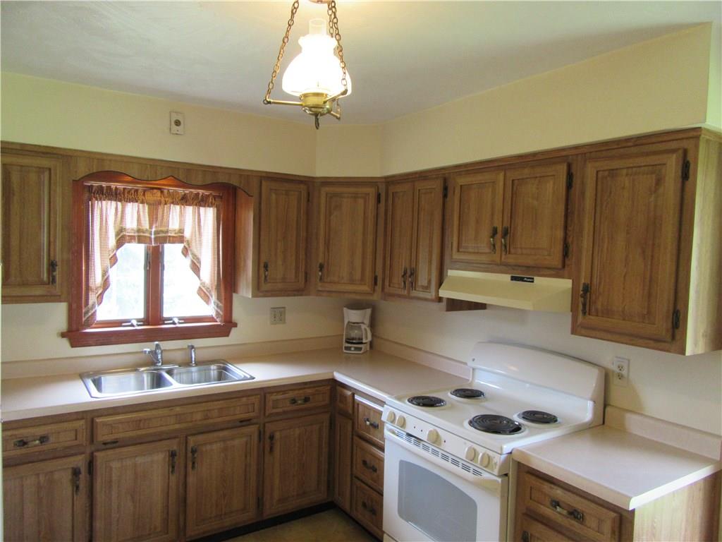 511 Coal Valley Road Jefferson Hills, PA 15025 - Photo 6 of 25 Kitchen is stacked with plenty of cabinet space and roomy enough for a small table to enjoy an eat-in kitchen area.