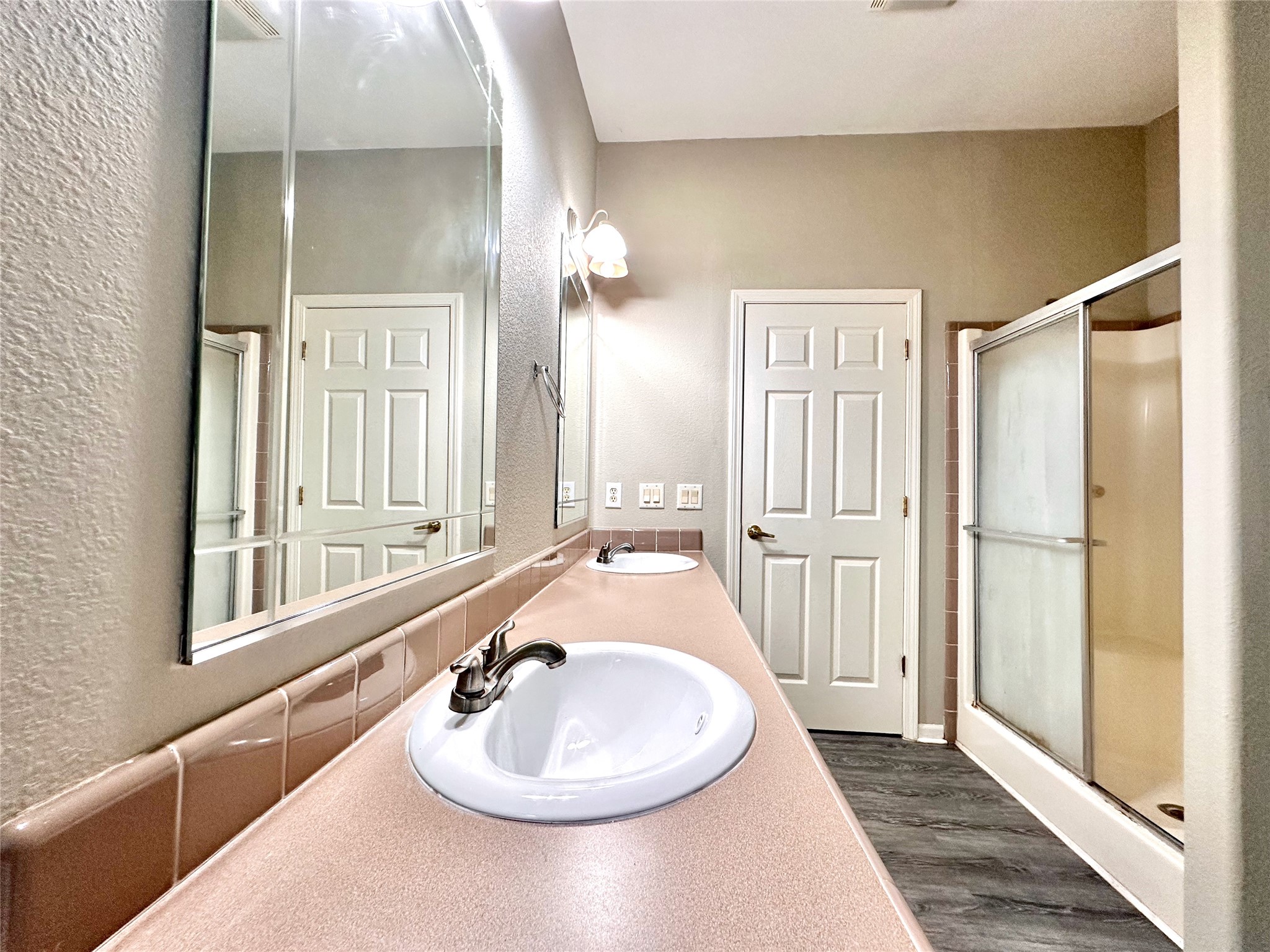 202 Main Street Fresno, TX 77545 - Photo 21 of 26 a bathroom with a sink and a mirror