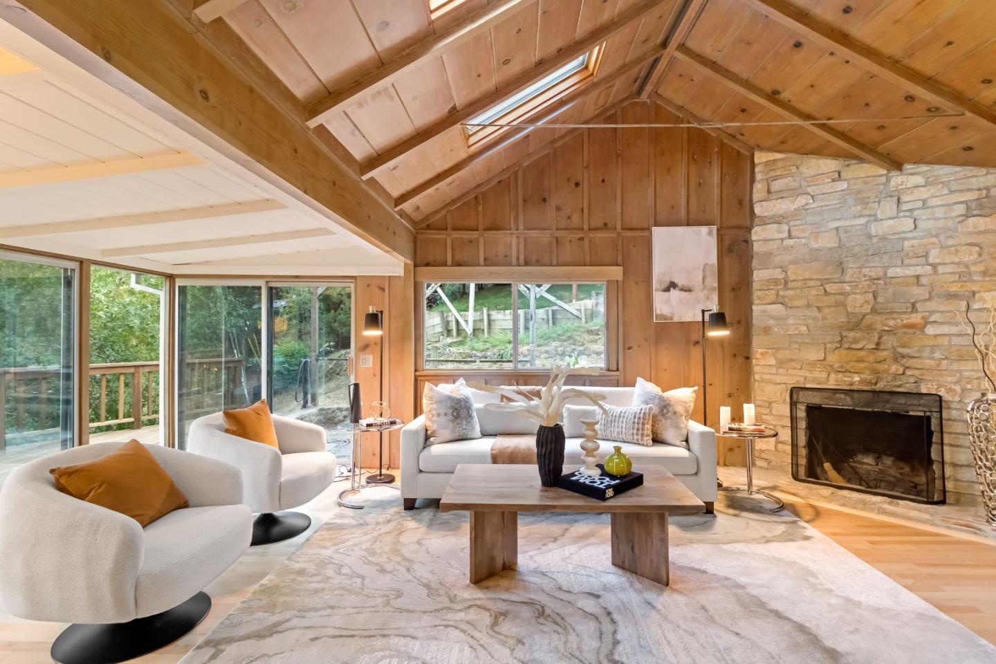 1019 Los Trancos Road Portola Valley, CA 94028 - Photo 17 of 63 a living room with furniture and a fireplace