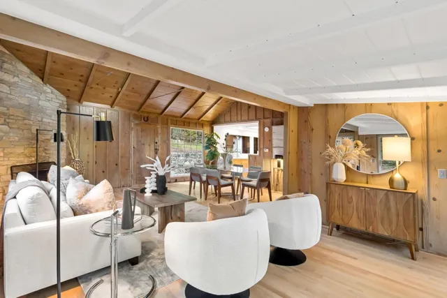 a large white kitchen with a large window