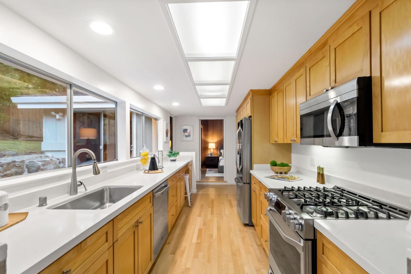 1019 Los Trancos Road Portola Valley, CA 94028 - Photo 22 of 63 a large kitchen with stainless steel appliances granite countertop a lot of counter space and a sink