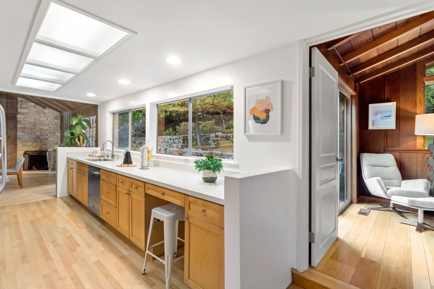 1019 Los Trancos Road Portola Valley, CA 94028 - Photo 26 of 63 a large white kitchen with a large window