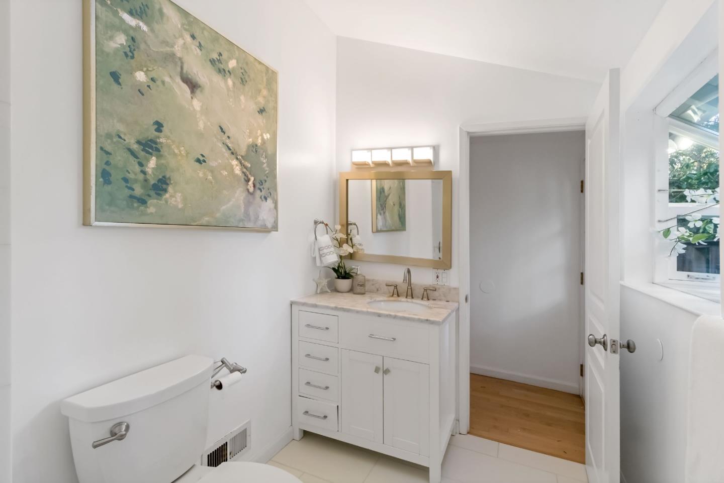 1019 Los Trancos Road Portola Valley, CA 94028 - Photo 34 of 63 a bathroom with a double vanity sink toilet and a mirror