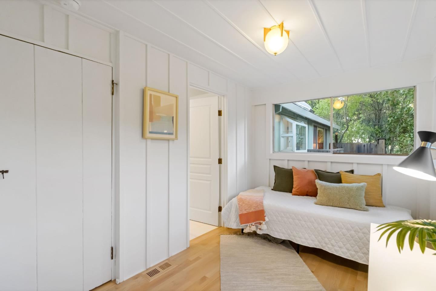 1019 Los Trancos Road Portola Valley, CA 94028 - Photo 37 of 63 a bedroom with furniture and a window