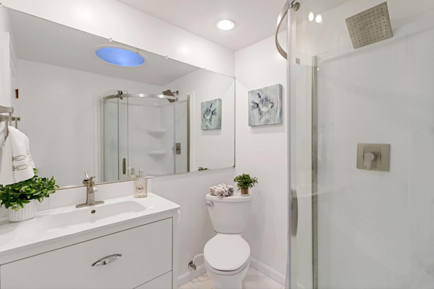 1019 Los Trancos Road Portola Valley, CA 94028 - Photo 38 of 63 a bathroom with a toilet sink and mirror