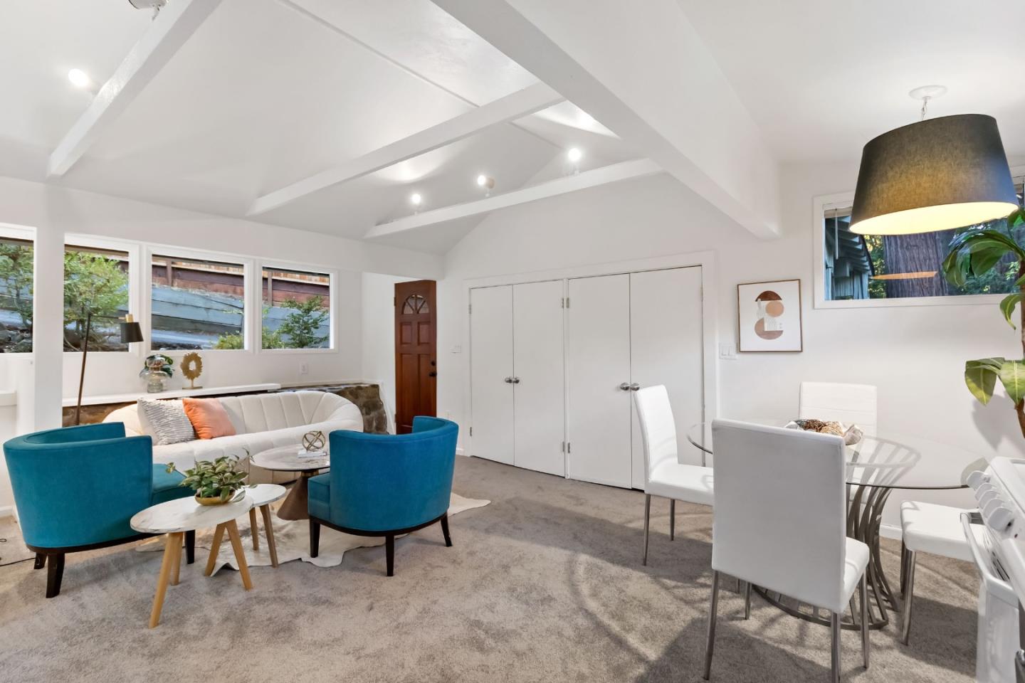 1019 Los Trancos Road Portola Valley, CA 94028 - Photo 44 of 63 a living room with furniture and a lamp