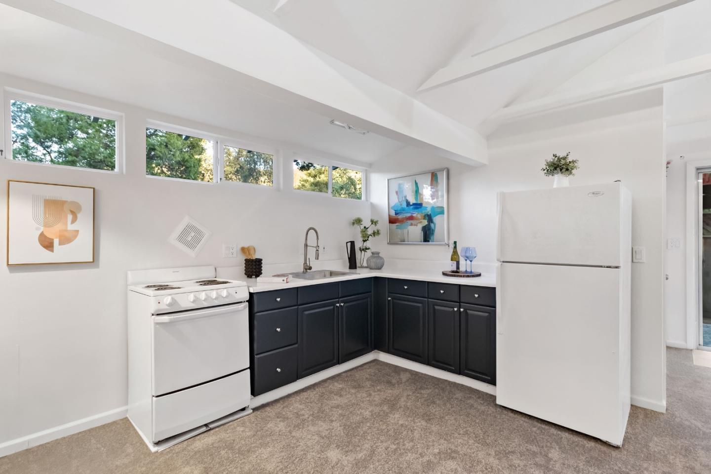 1019 Los Trancos Road Portola Valley, CA 94028 - Photo 47 of 63 a kitchen with a white cabinets and white appliances
