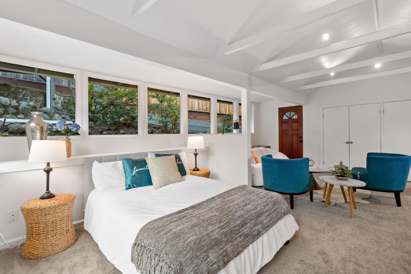 1019 Los Trancos Road Portola Valley, CA 94028 - Photo 49 of 63 a bedroom with furniture and a large window