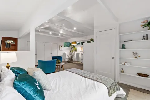 an aerial view of a house with a yard