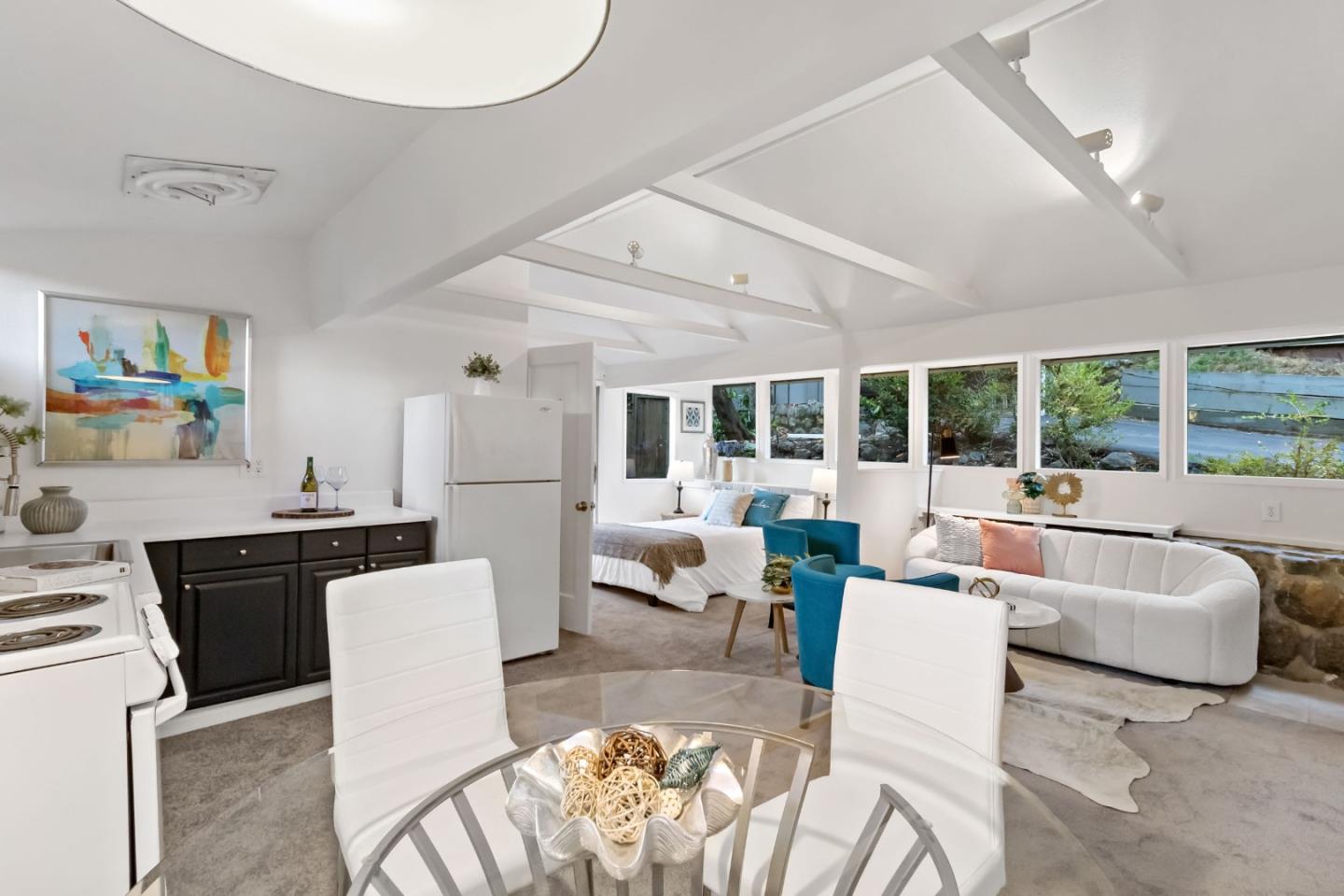 1019 Los Trancos Road Portola Valley, CA 94028 - Photo 52 of 63 a living room with furniture a fireplace and a large window