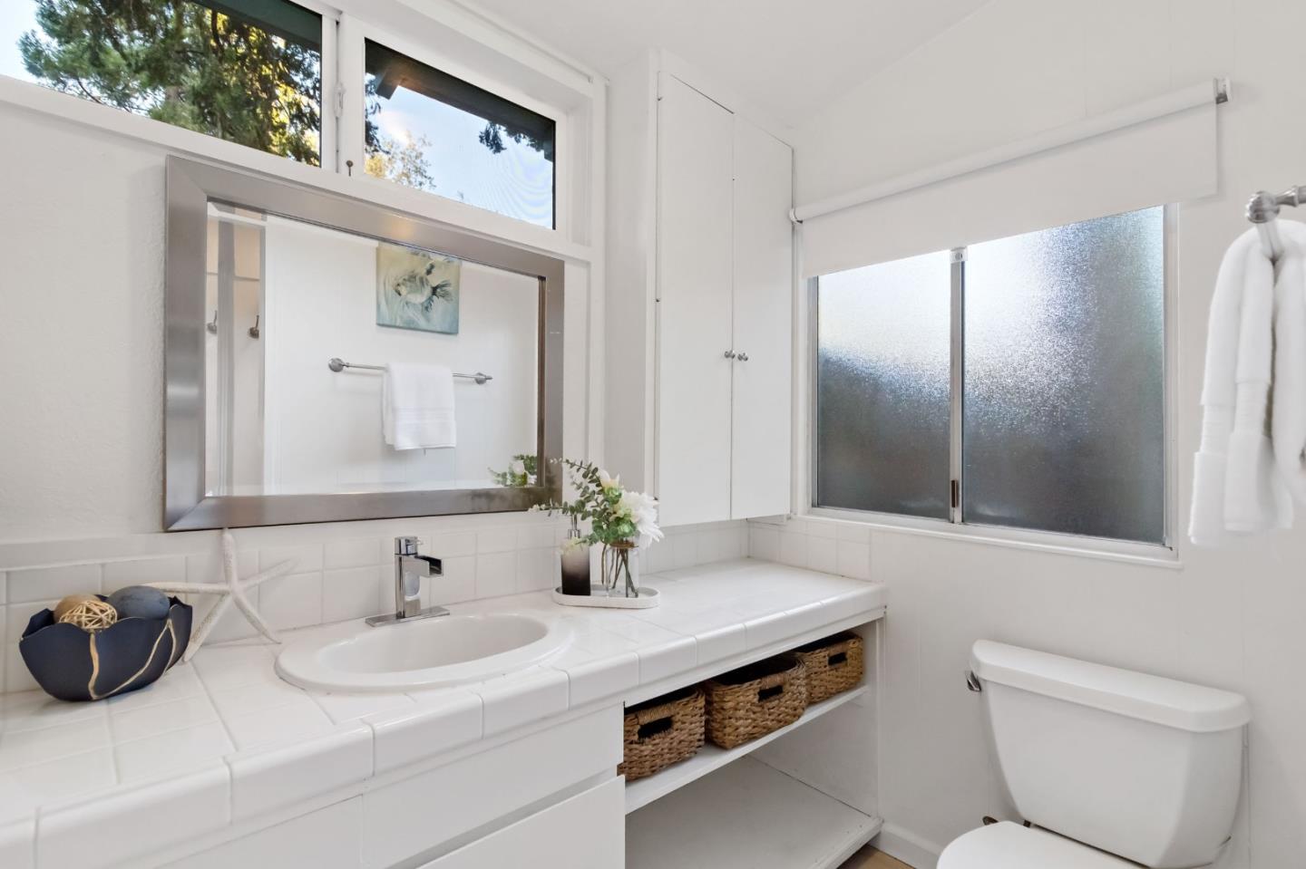 1019 Los Trancos Road Portola Valley, CA 94028 - Photo 54 of 63 a bathroom with a sink and a mirror