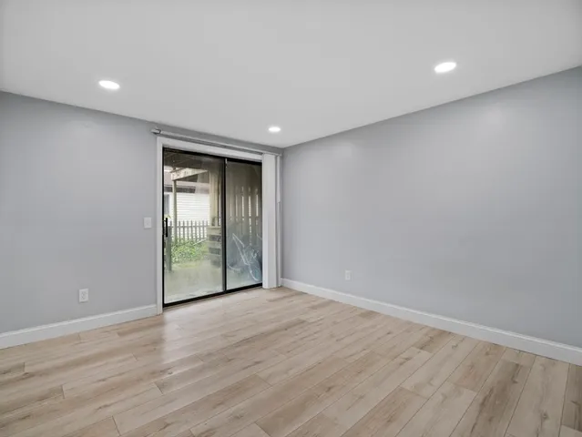 an empty room with wooden floor