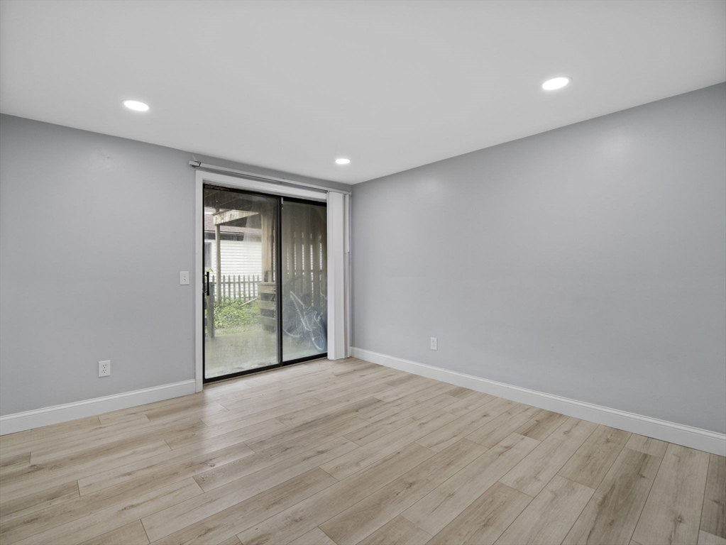 24 Bettys Pond Road, Unit K Barnstable, MA 02601 - Photo 26 of 40 a view of an empty room with wooden floor