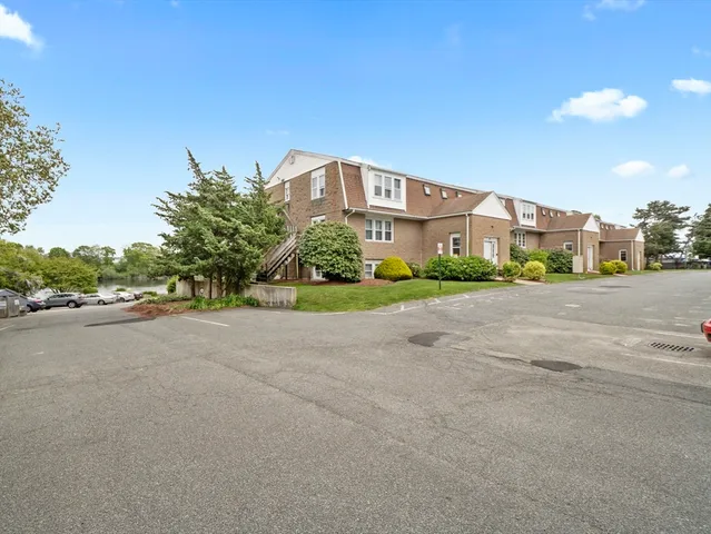 a view of a street with a building in the background