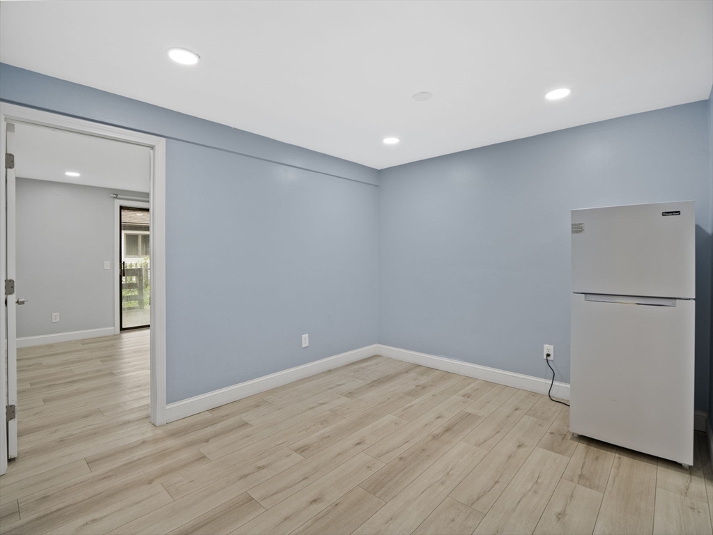 24 Bettys Pond Road, Unit K Barnstable, MA 02601 - Photo 31 of 40 a view of empty room with wooden floor