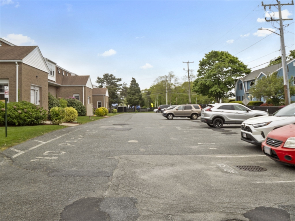 24 Bettys Pond Road, Unit K Barnstable, MA 02601 - Photo 4 of 40 a cars parked on the side of a street