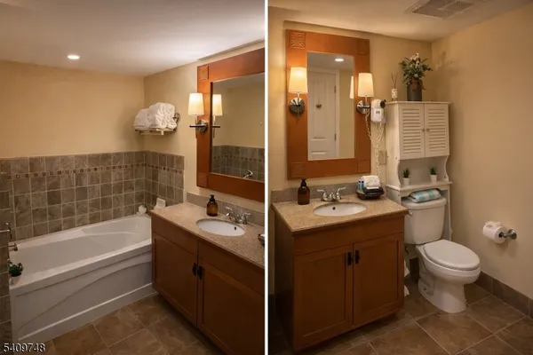 a bathroom with a double vanity sink toilet mirror and bathtub