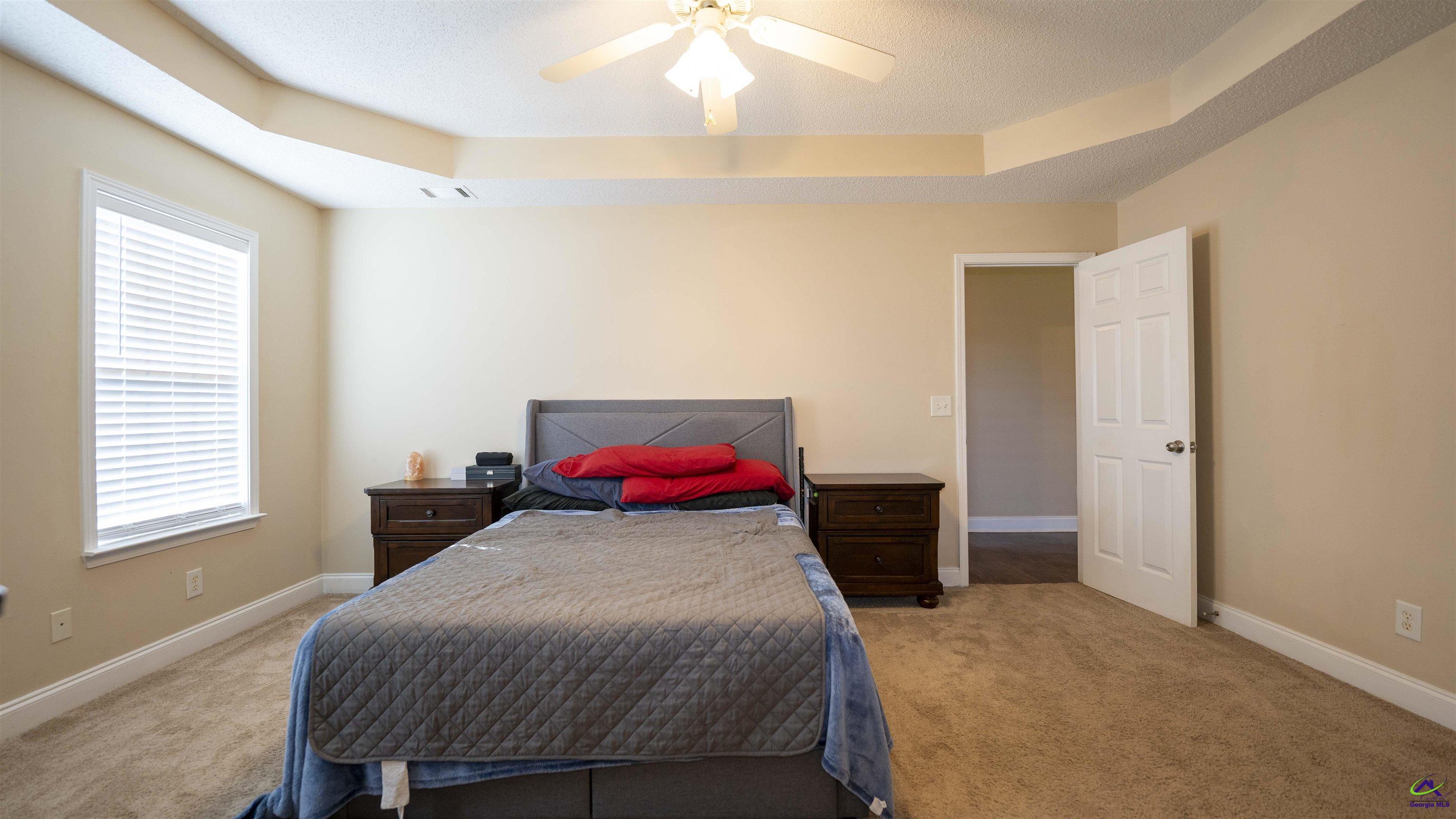 311 Sugarloaf Parkway Perry, GA 31069 - Photo 15 of 31 a bedroom with a bed and a closet