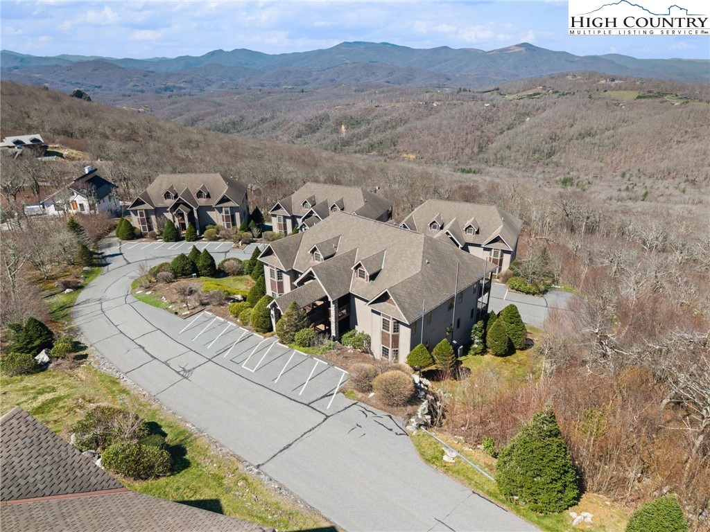 143 Wildflower Ridge, Unit 17D Sugar Mountain, NC 28604 - Photo 2 of 36 an aerial view of a house with a mountain