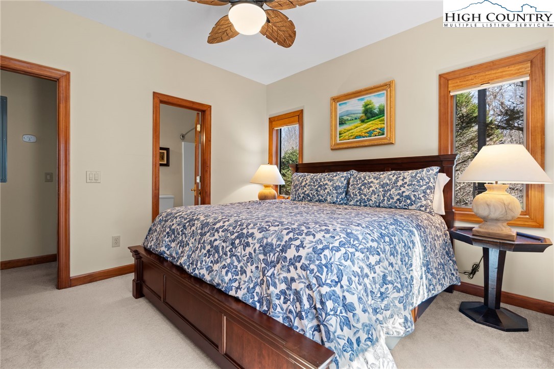 143 Wildflower Ridge, Unit 17D Sugar Mountain, NC 28604 - Photo 22 of 36 a bedroom with bed and window