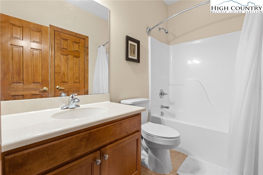 143 Wildflower Ridge, Unit 17D Sugar Mountain, NC 28604 - Photo 24 of 36 a bathroom with a sink a toilet and shower